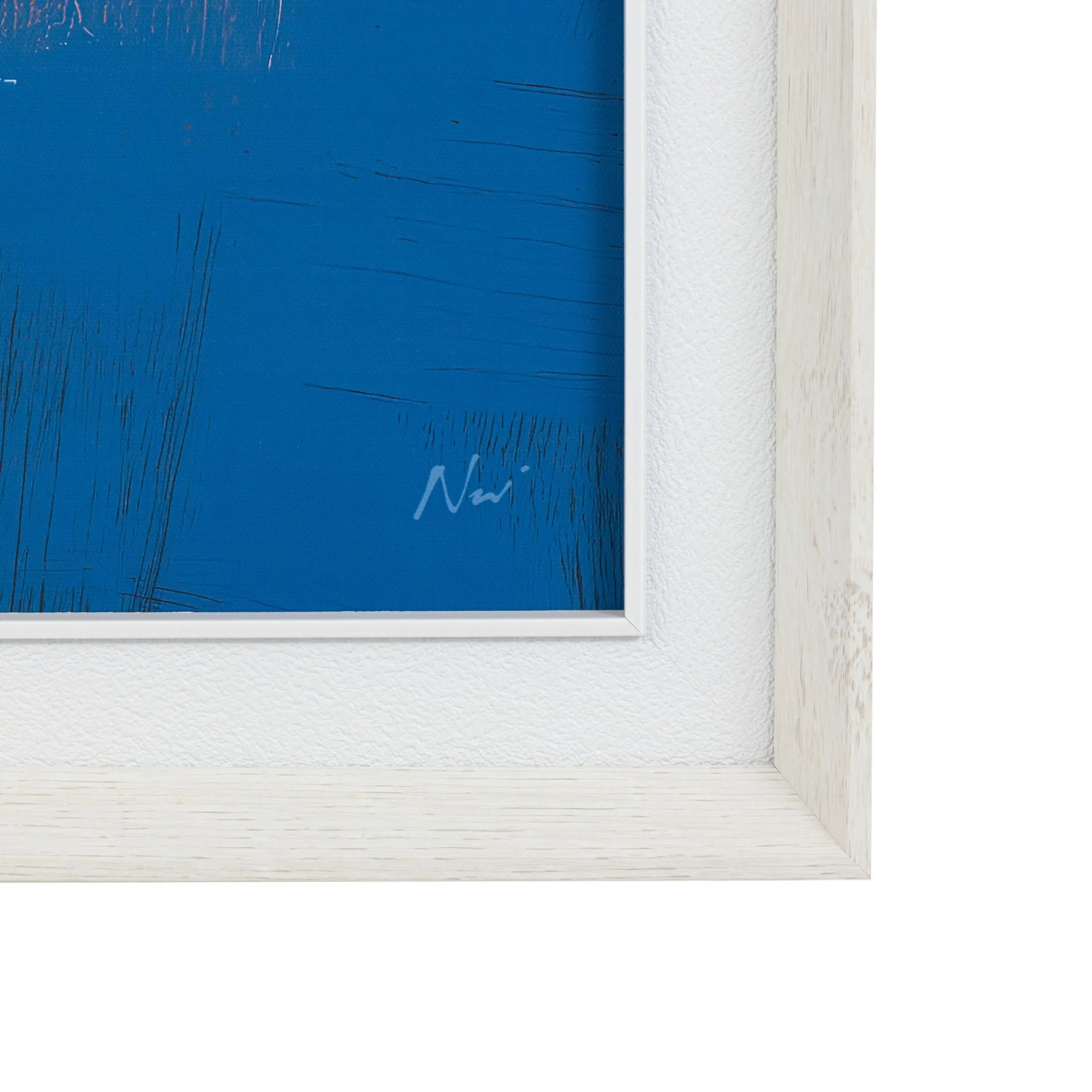 Framed abstract artwork with a blue background and white frame