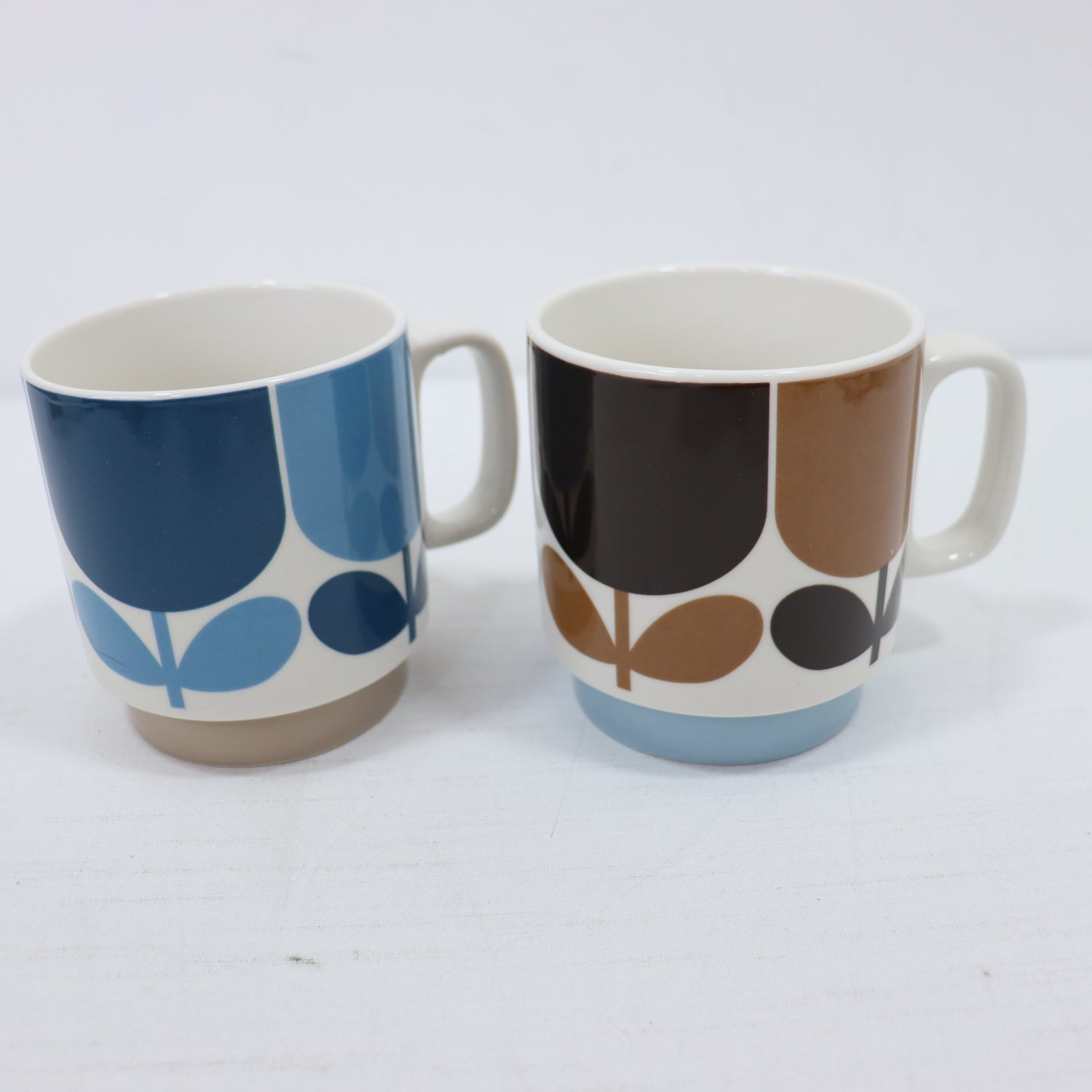 two cups on a white surface