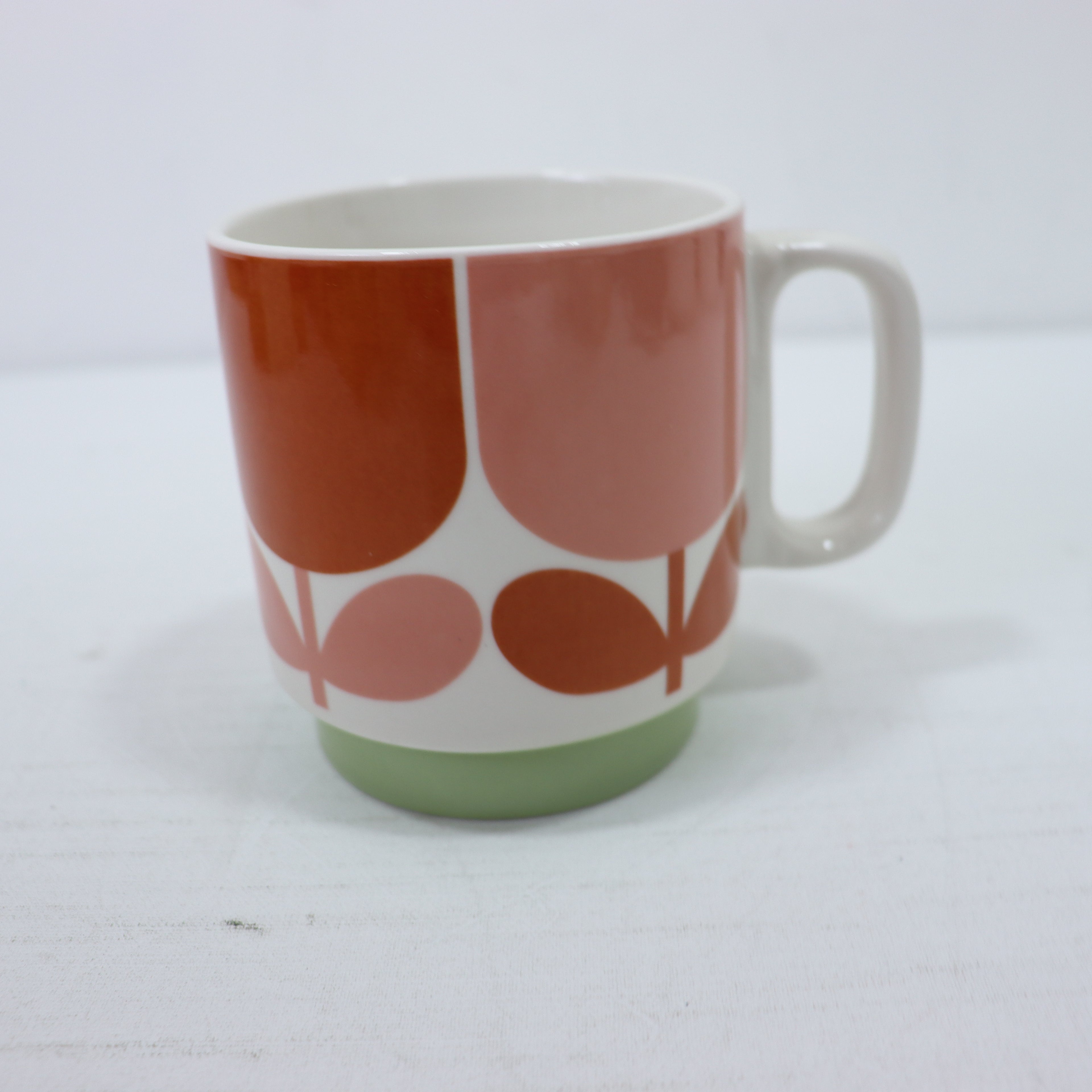 a coffee cup with a white handle