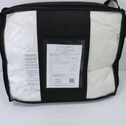 a black and white bag with a white sheet