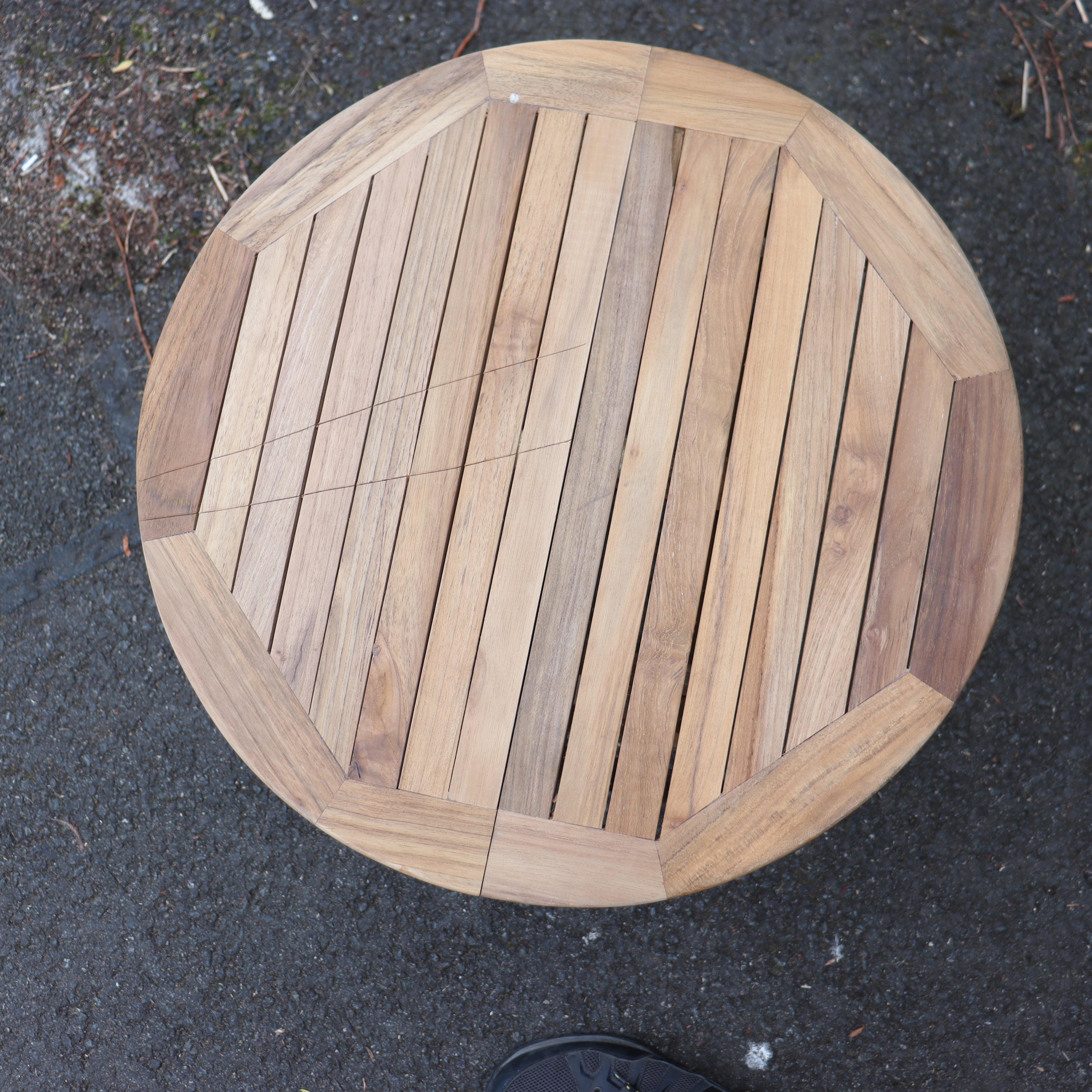 a wooden table on the ground