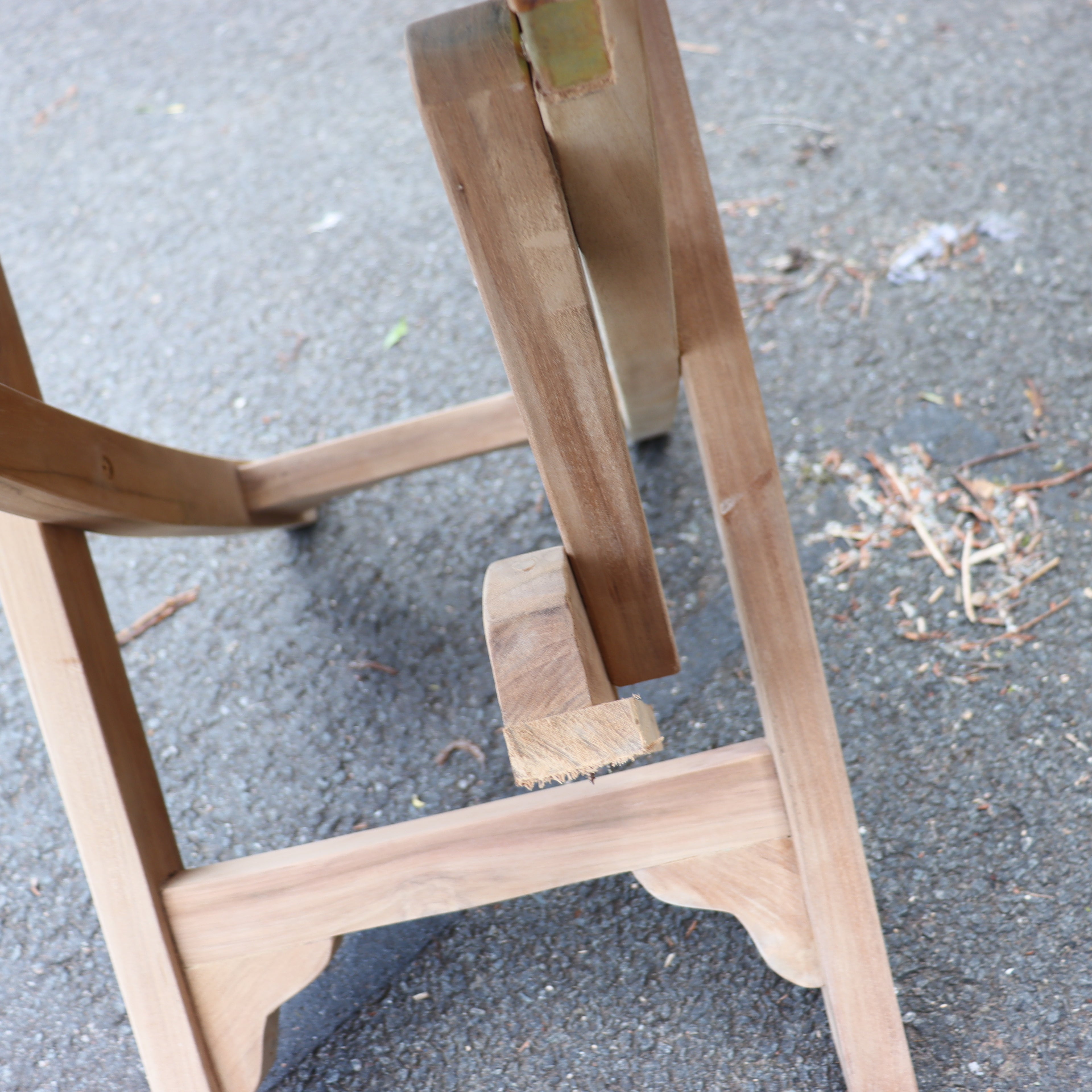 a wooden chair leg on the ground