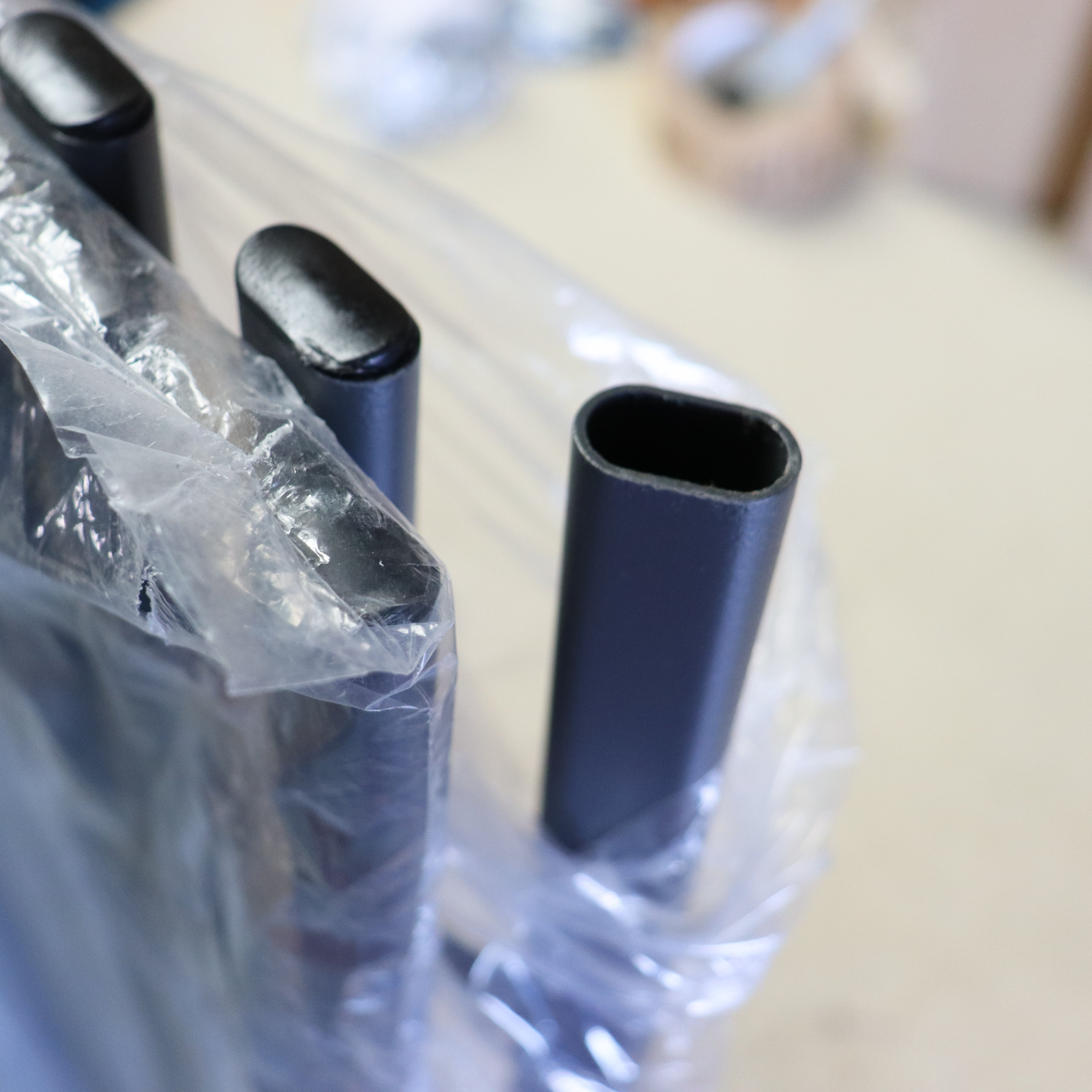 a plastic bag with black tubes