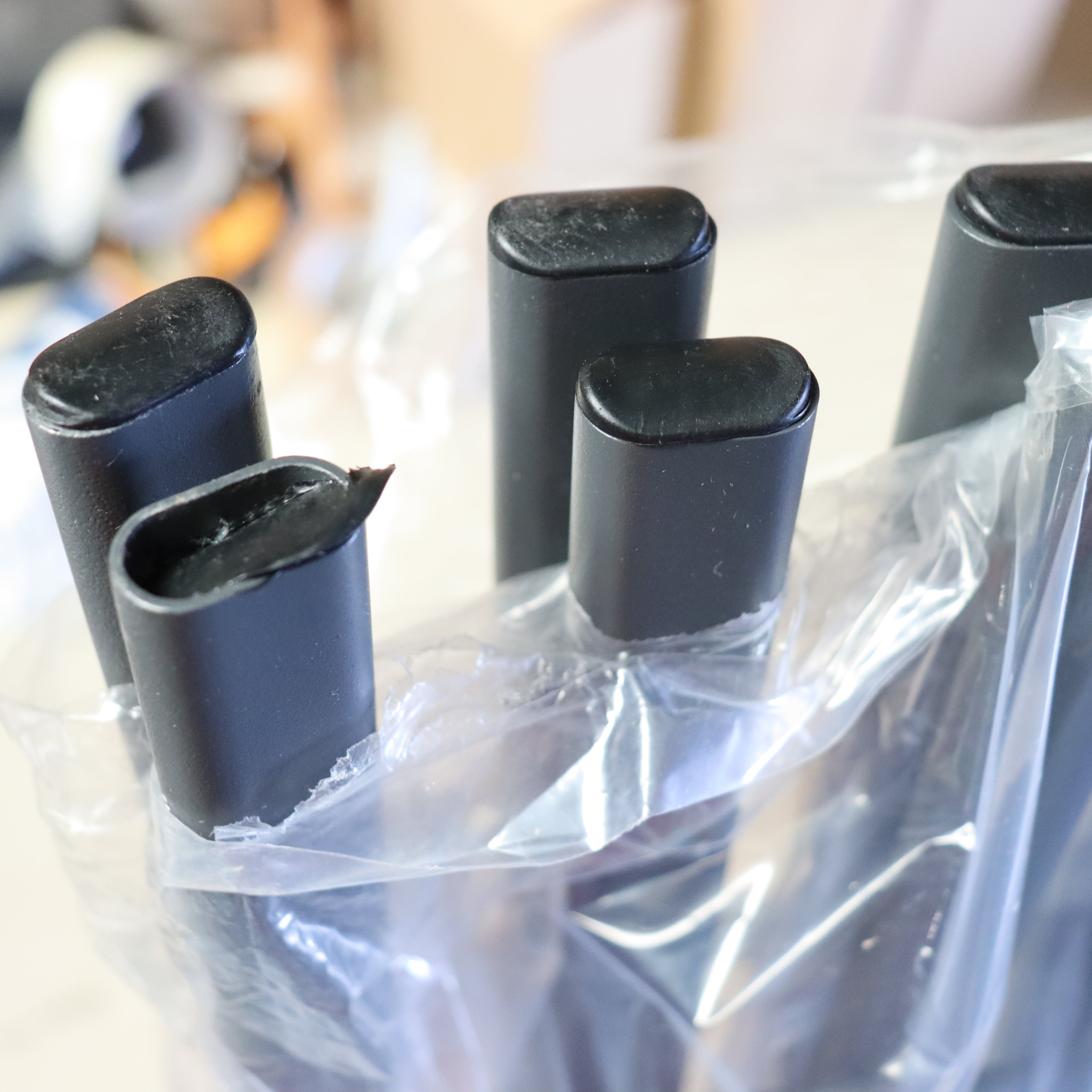 a group of black objects in a plastic bag