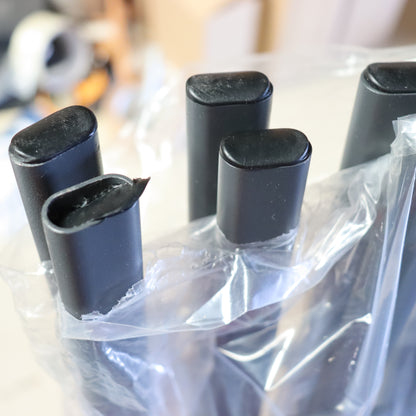 a group of black objects in a plastic bag
