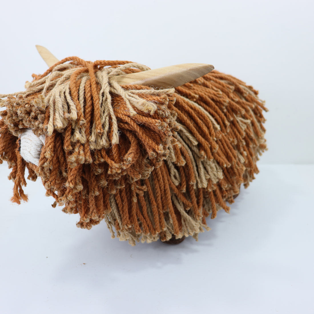 a brown and white yarn sheep