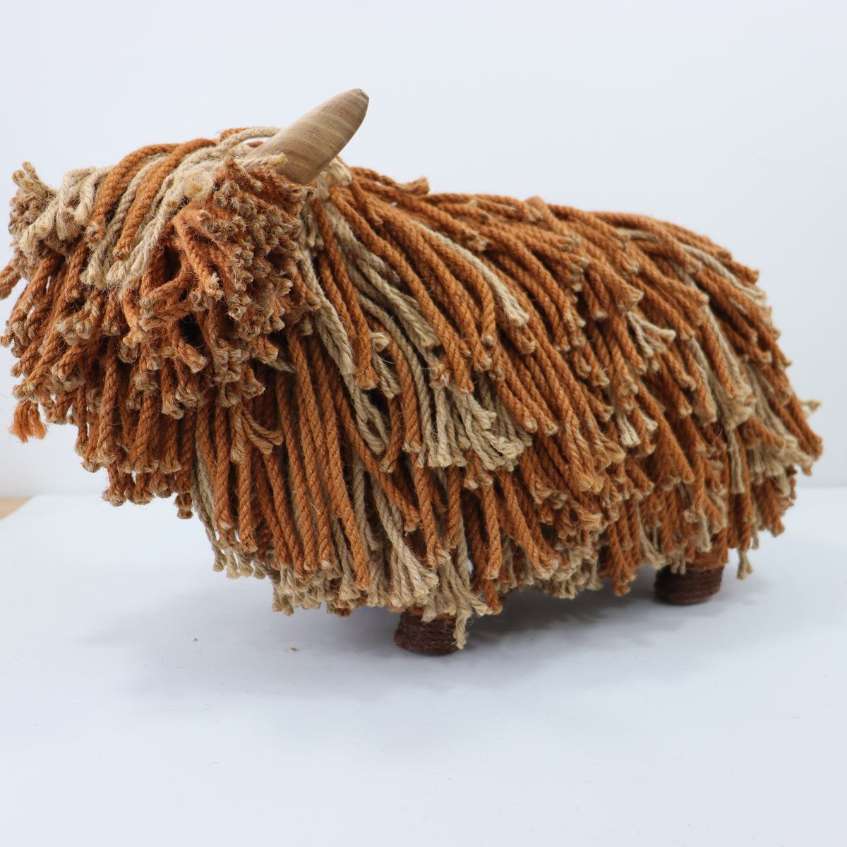 a brown and white yarn sculpture