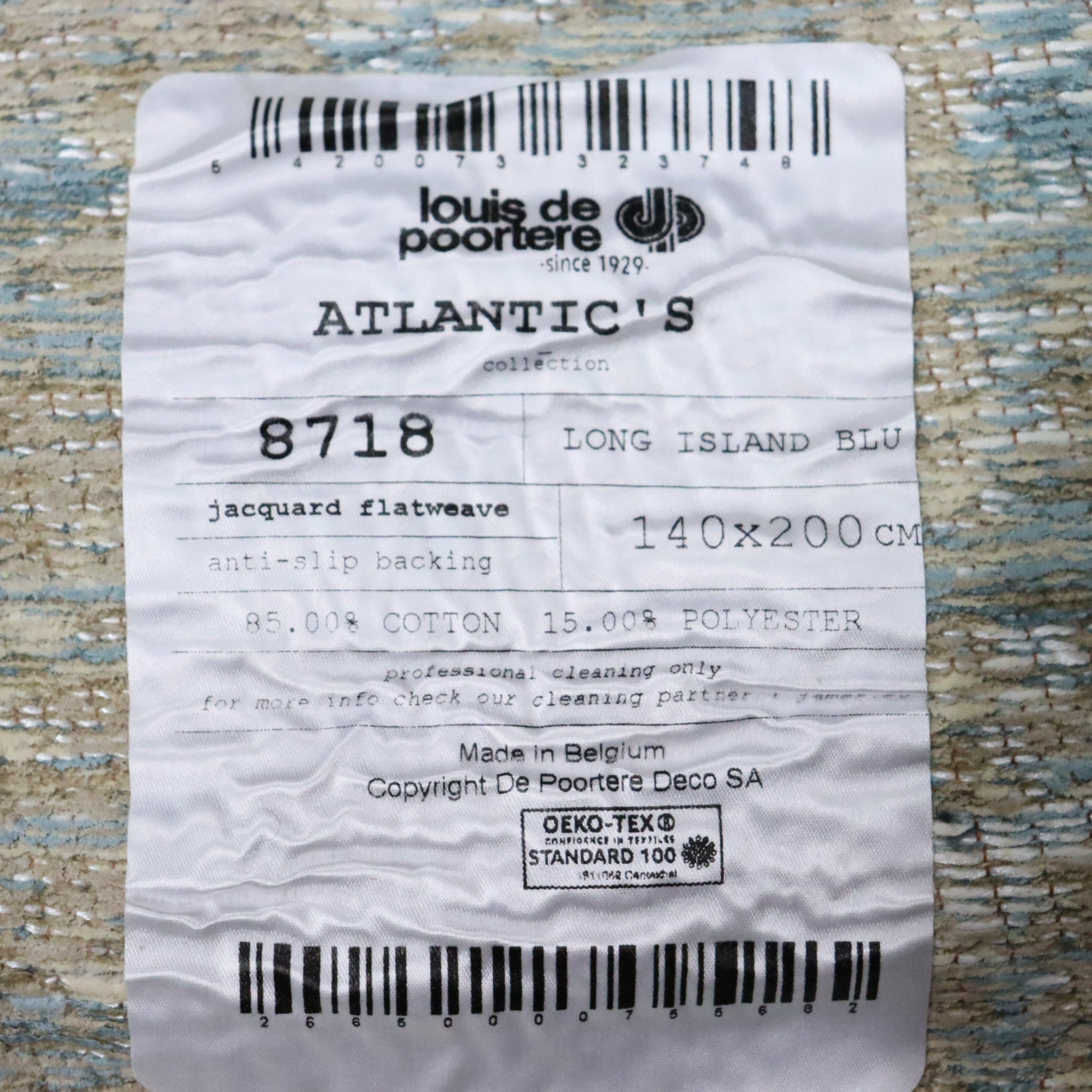 Label from Louis de Poortere with product details on a textured surface