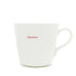 A white ceramic coffee mug with the words &