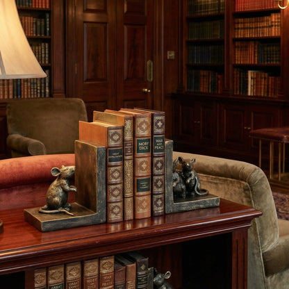 Cozy room with a fireplace, bookshelf, and armchair.