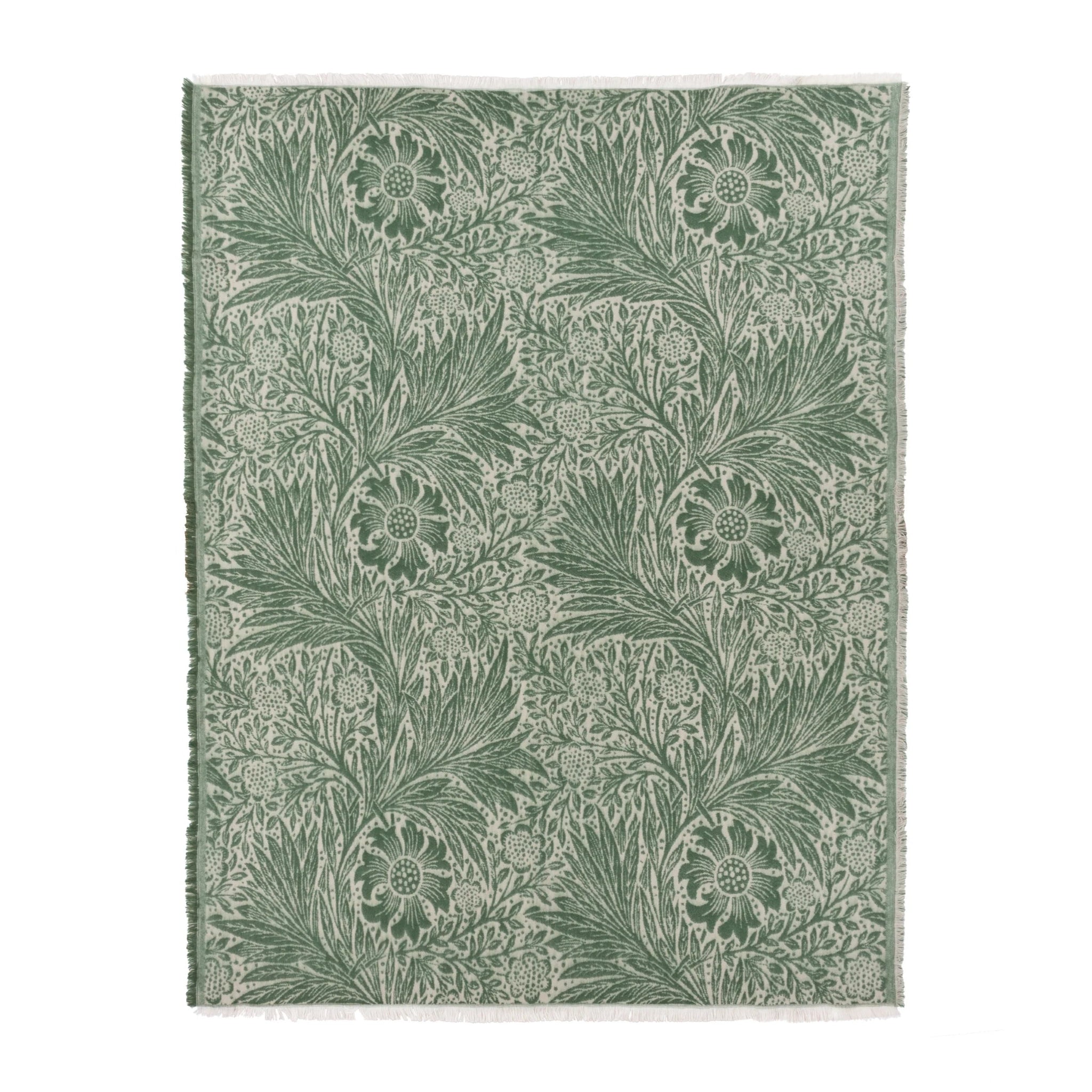 Green floral patterned rug on a white background