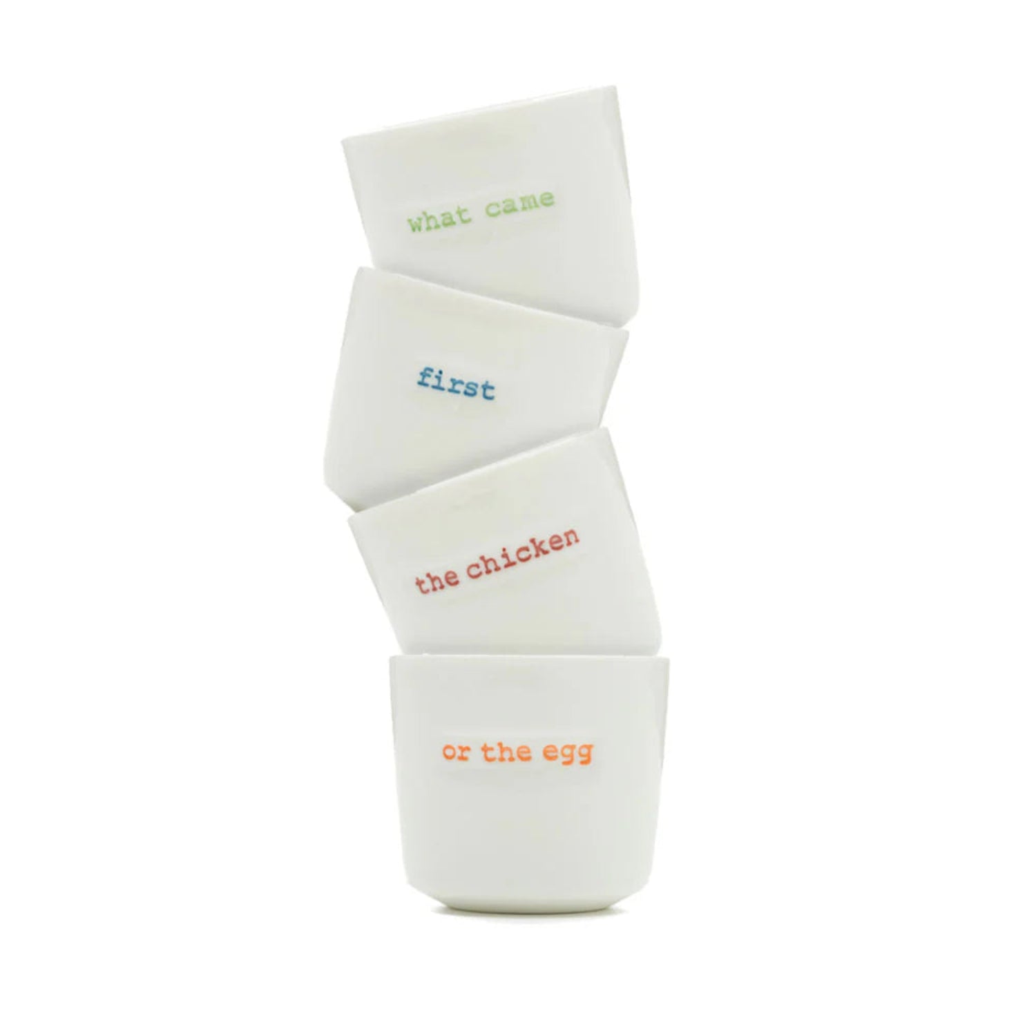 Stack of white ceramic eggs with text on a white background