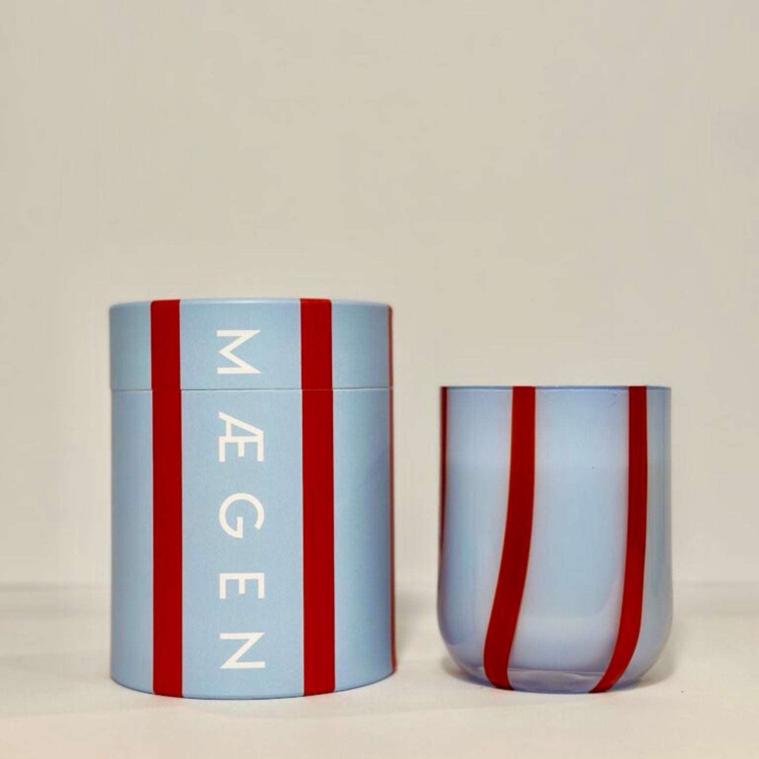 Light blue cylindrical container with red stripes and &