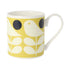 Mug with bird and leaf pattern on a yellow background