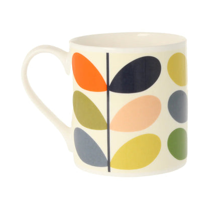 Mug with colorful leaf pattern on a white background