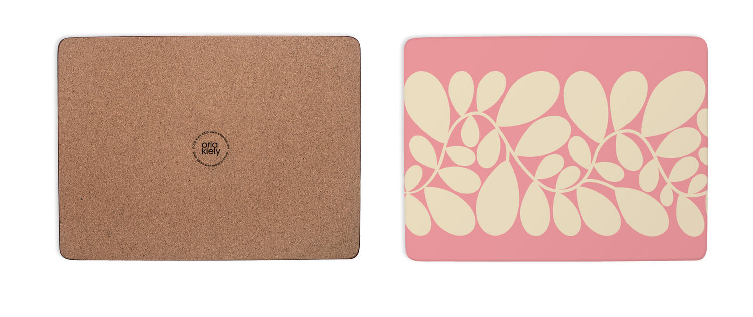 Two mouse pads, one cork texture and one with floral design on pink background