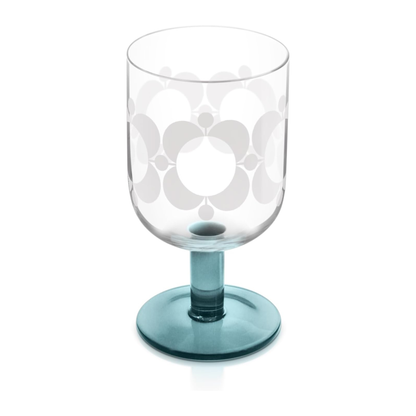 Clear glass with floral design and blue stem on a white background