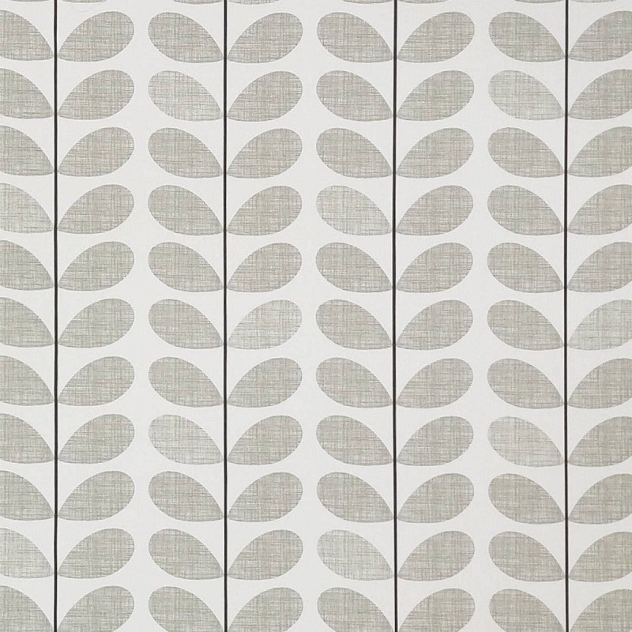 A close-up of a fabric pattern featuring a repeating vertical row of gray leaf-like teardrop shapes on a white background.