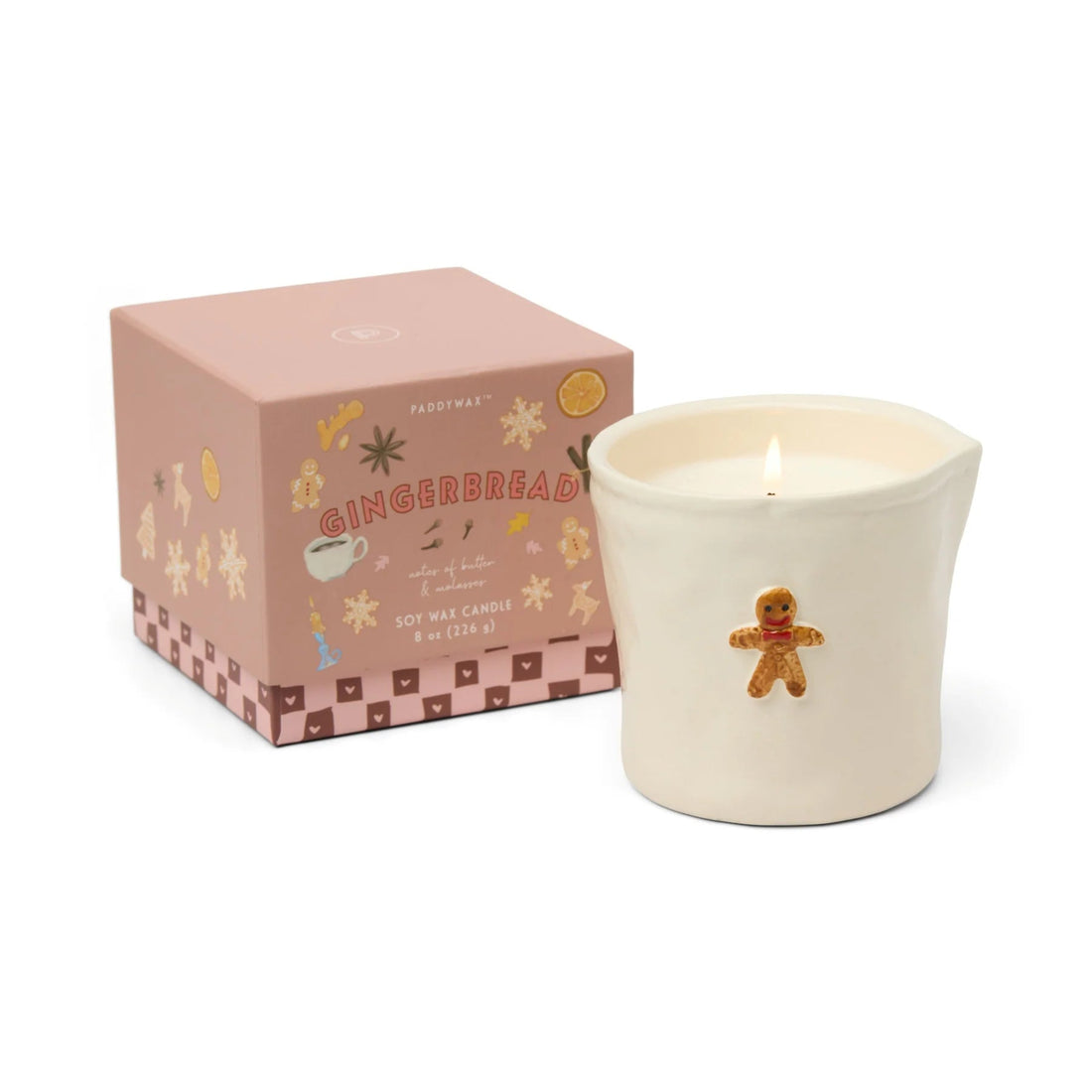 Gingerbread-themed candle with decorative packaging on a white background