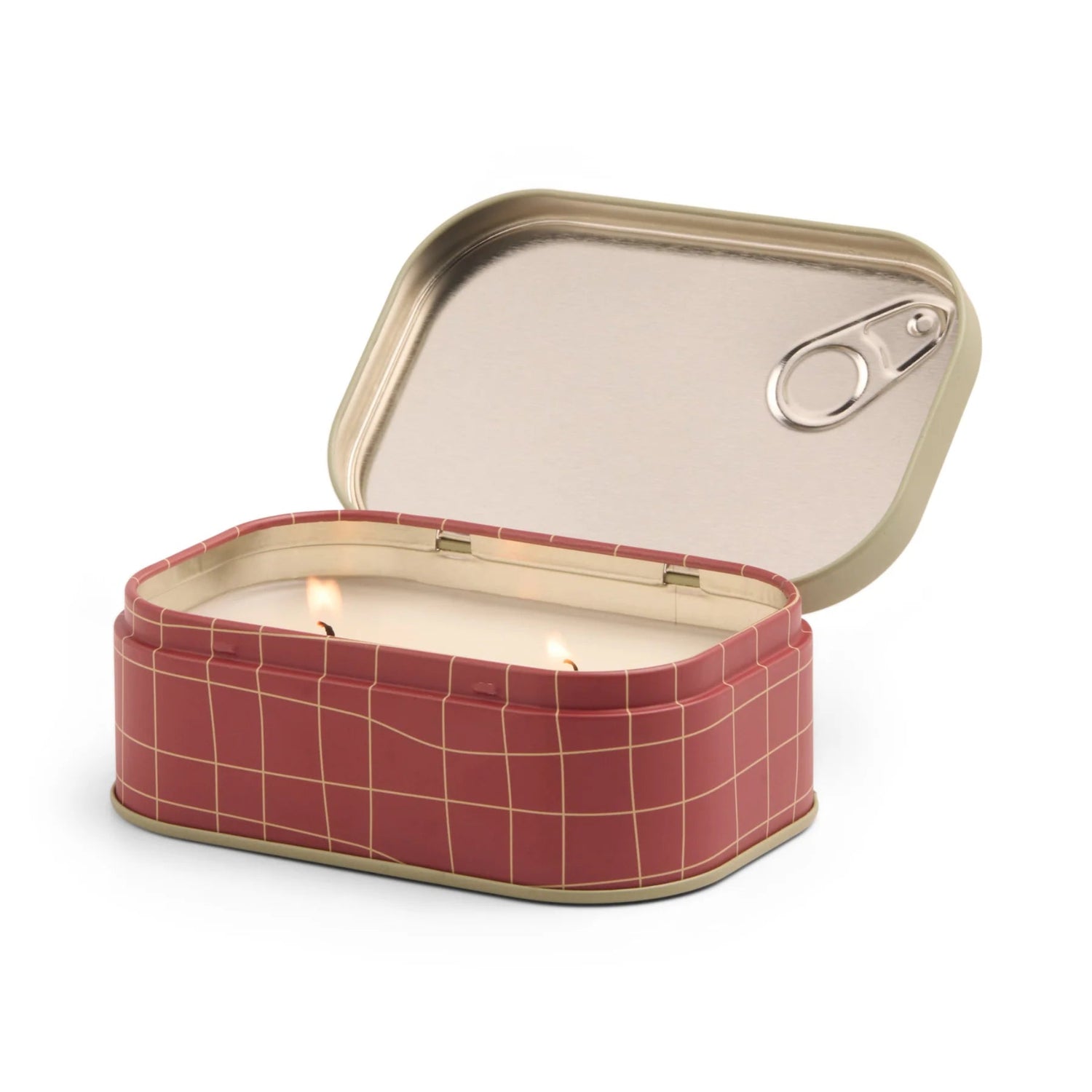 Candle in a red grid-patterned tin can with a metal lid on a white background