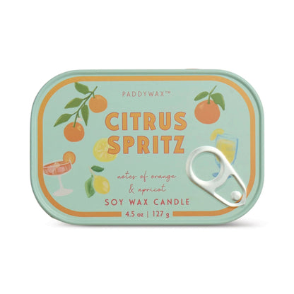 Paddywax Citrus Spritz candle tin with illustrations of citrus fruits on a light green background