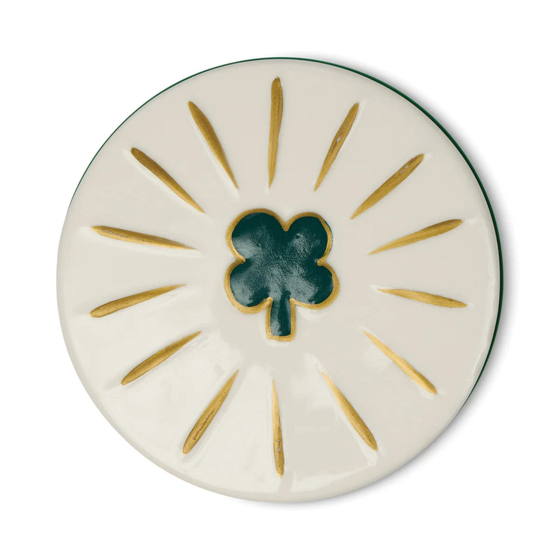 Round ceramic coaster with a green clover design on a white background