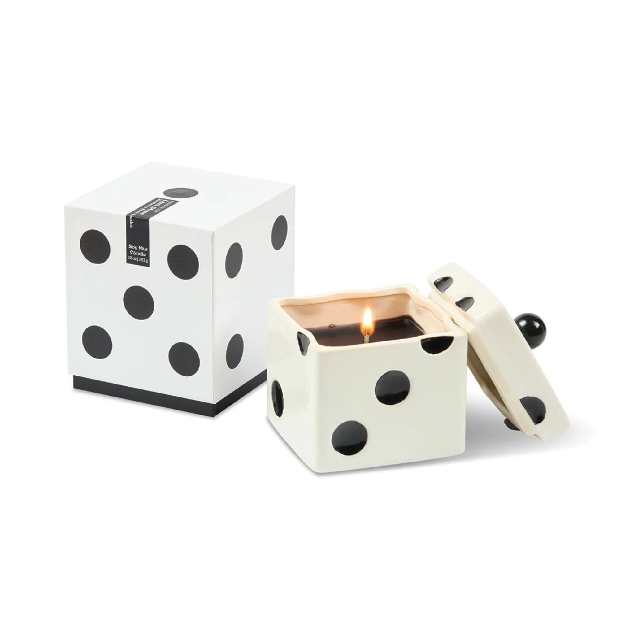 Polka dot candle in a box on a white background