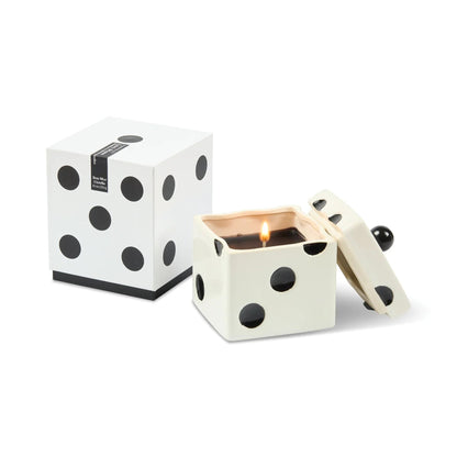 Polka dot candle in a box on a white background