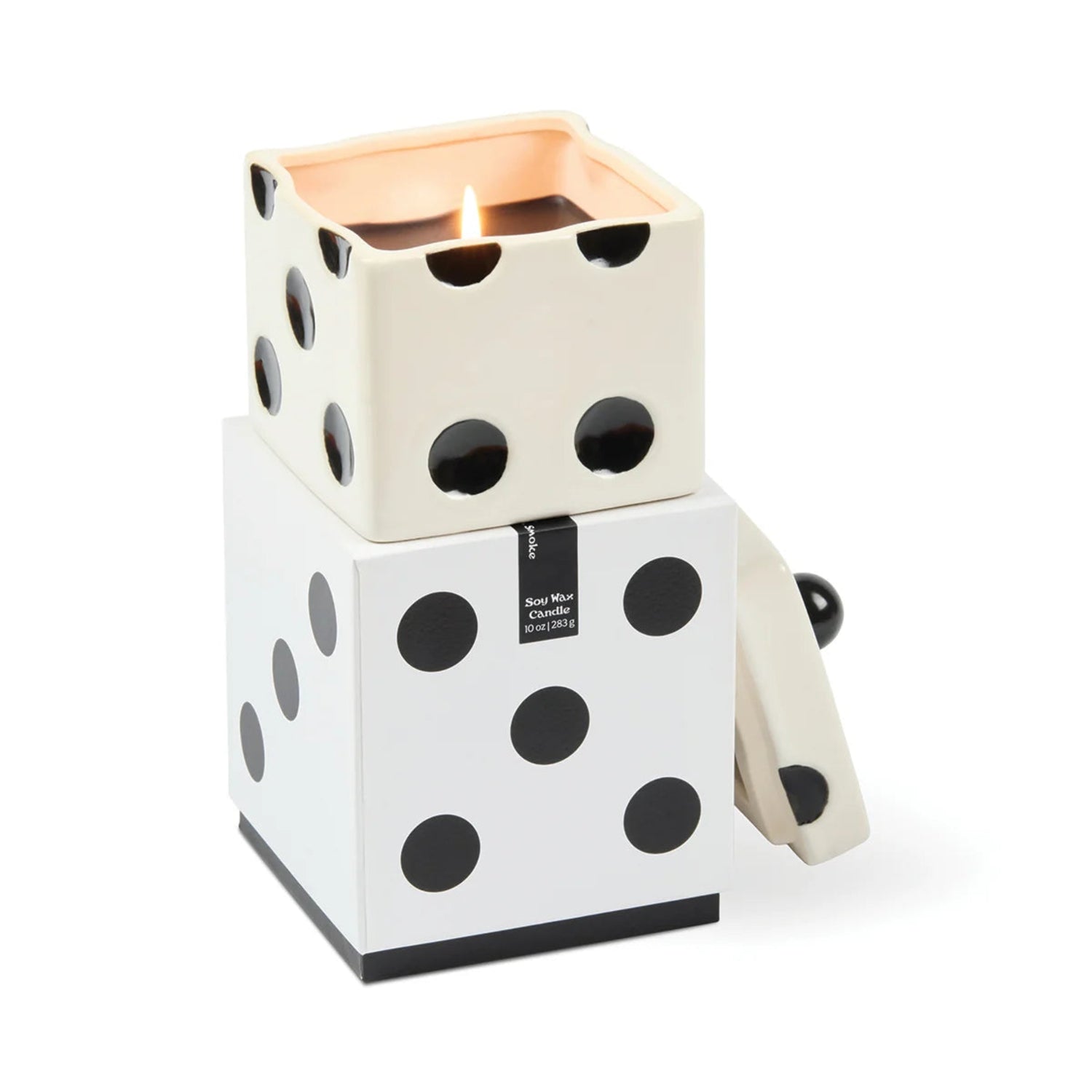 A dice-themed candle holder and container by Mon Mar Chantier, featuring a white and black polka-dot dice design with a lit candle inside a square top compartment, shown on a clean white background.