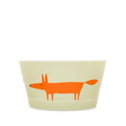 A light beige ceramic bowl featuring a stylized orange fox illustration on the side, set against a plain white background.