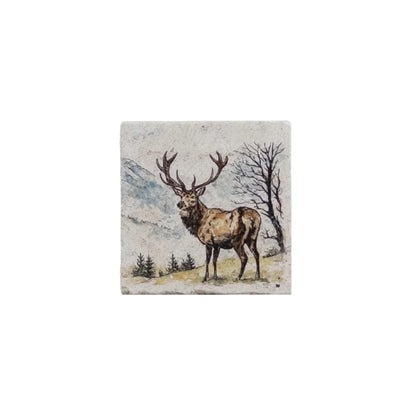 A square ceramic tile featuring a painted illustration of a stag with large antlers in a mountainous landscape, shown against a plain white background.