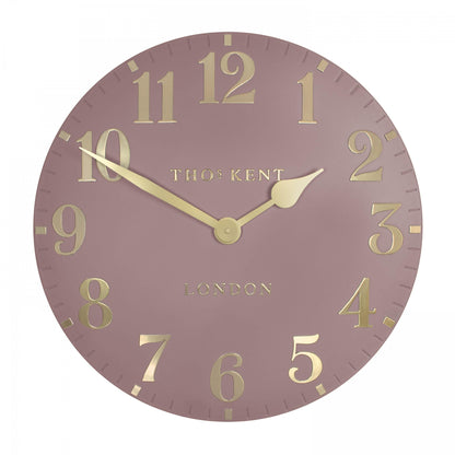 Round clock with gold numbers and &