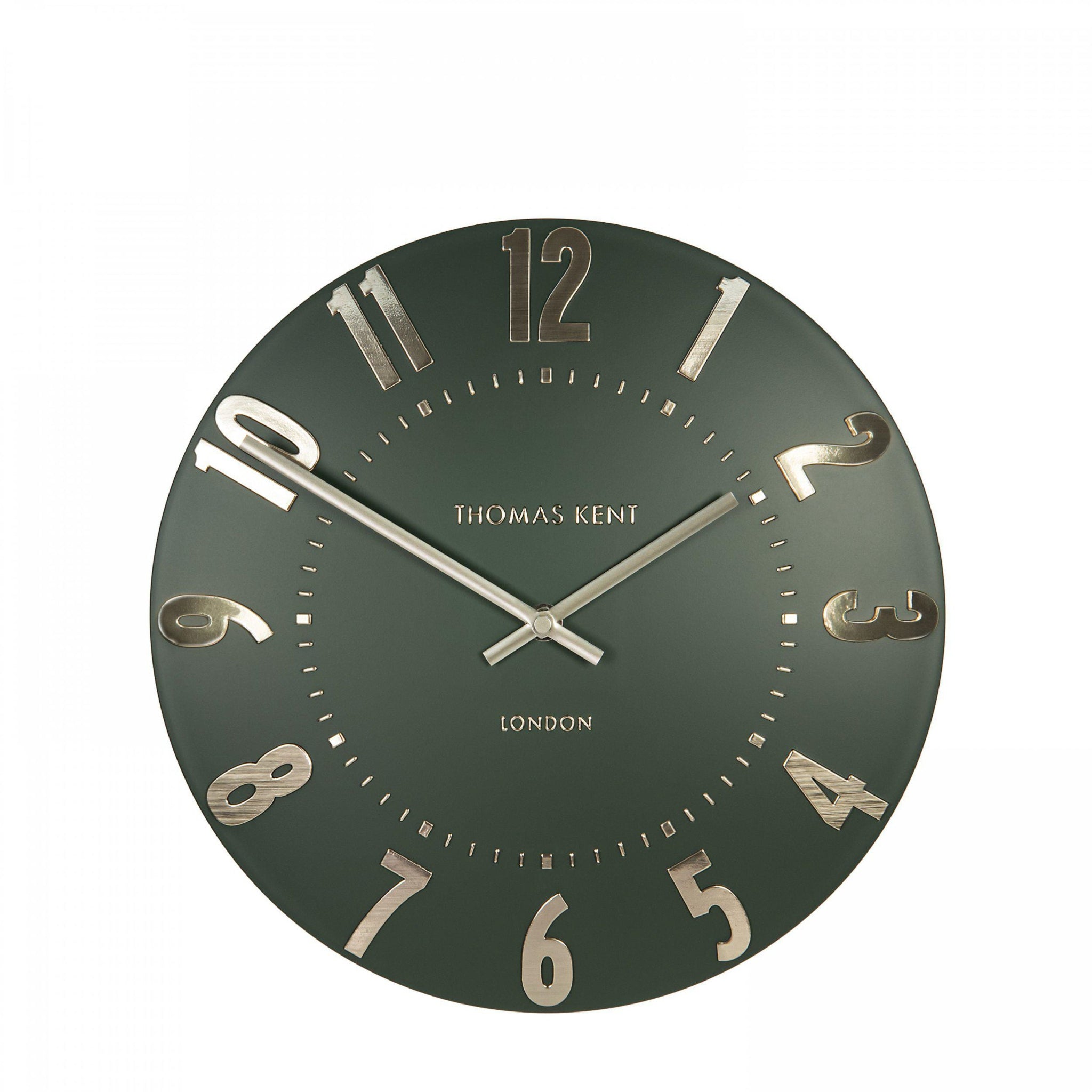 Green wall clock with gold accents on a white background