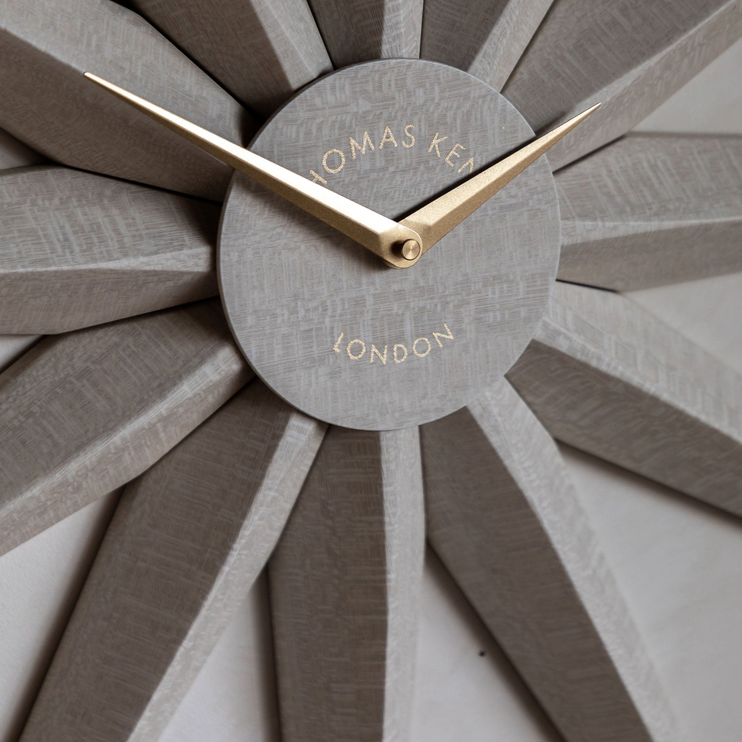 Wall clock with sunburst design and &
