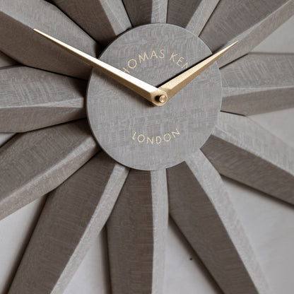 Wall clock with sunburst design and &