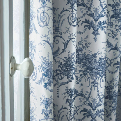Curtain with blue floral pattern on a white background