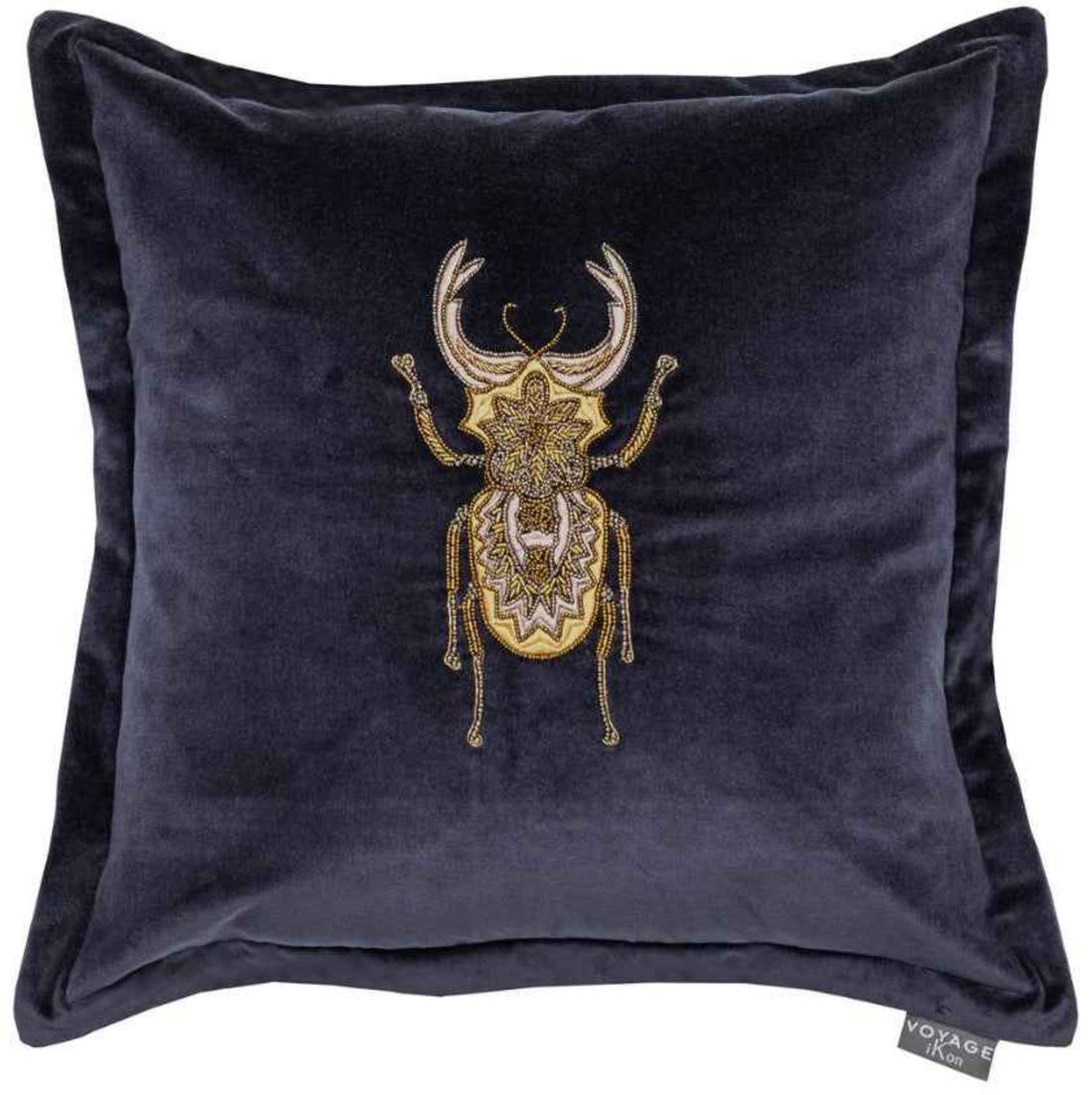 Navy velvet pillow with gold embroidered beetle design on a white background