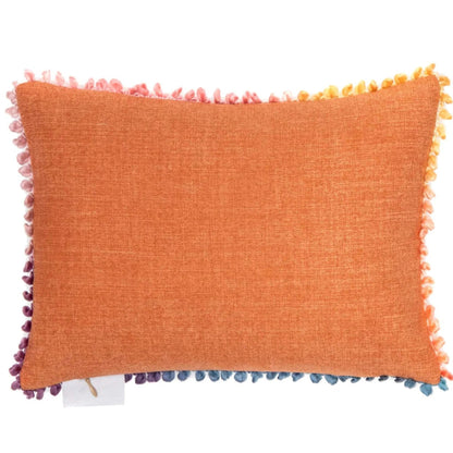 An orange textured throw pillow with multicolor pom-pom trim along all four edges, shown against a plain white background.