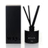 Black diffuser with sticks and packaging labeled &