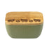 Green butter dish with wooden lid featuring engraved illustrations of sheep on a wooden lid