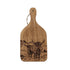 Wooden cutting board with engraved image of two highland cows on a white background