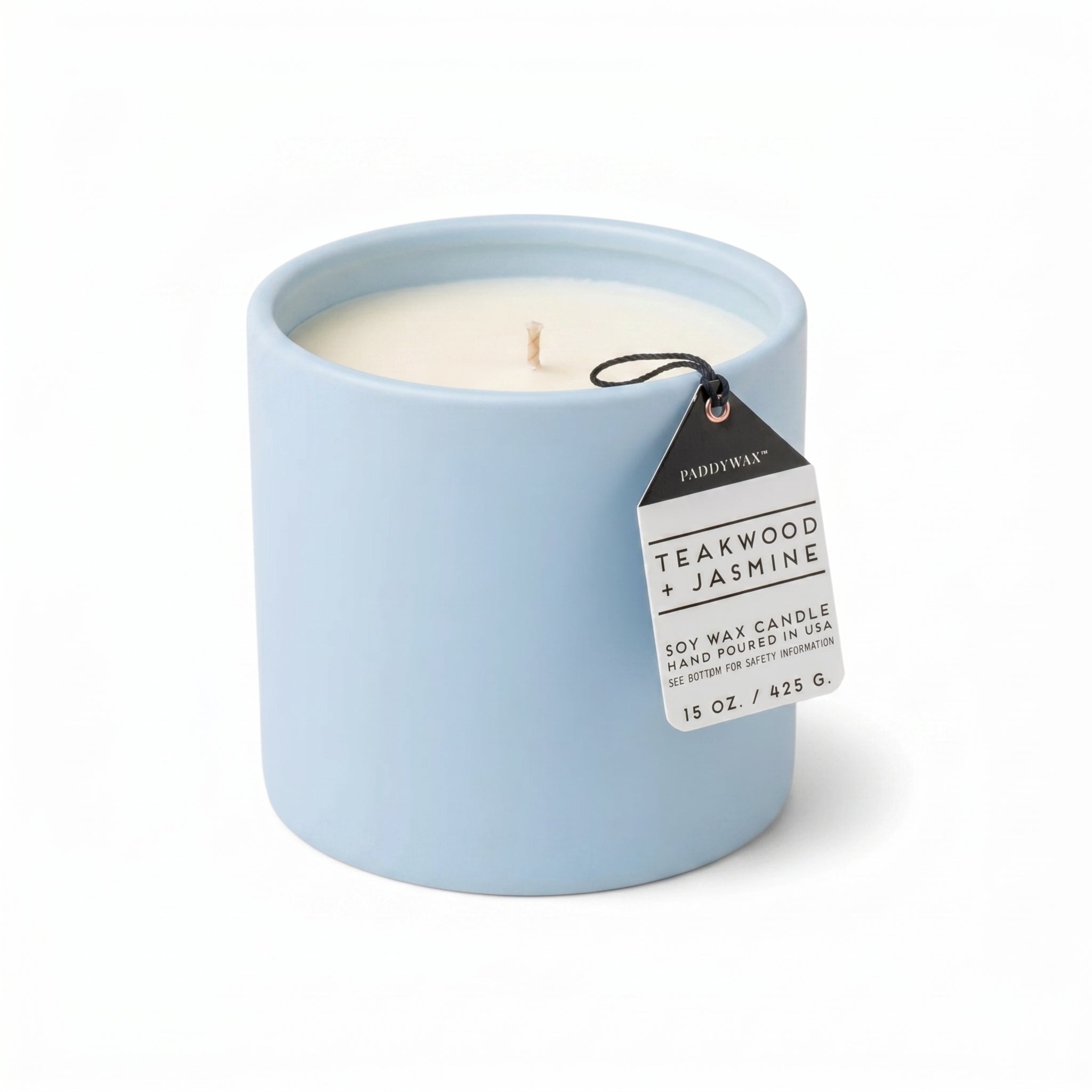 a blue candle with a white label