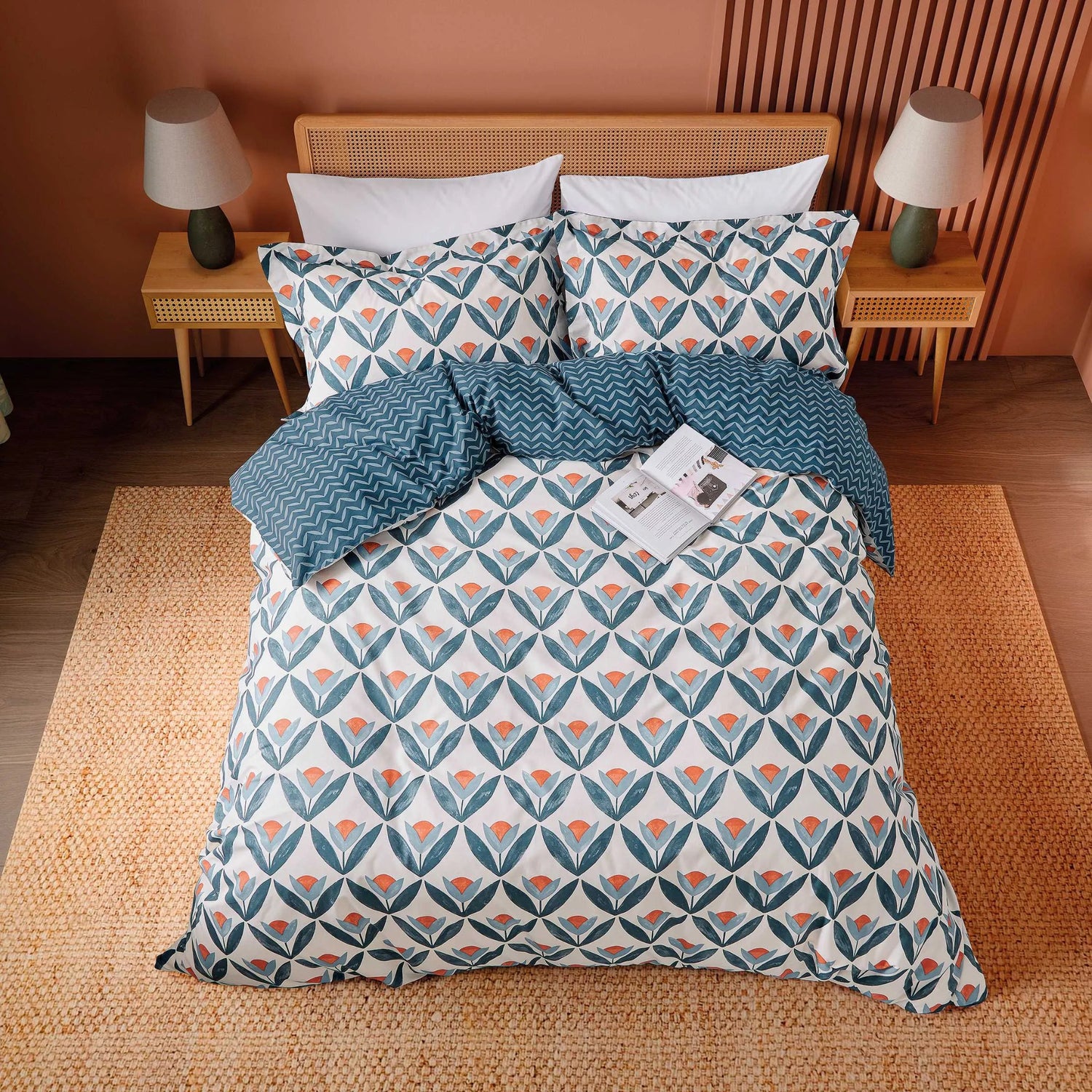 Bed with floral patterned bedding in a bedroom setting