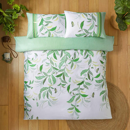 a bed with a green and white bedding